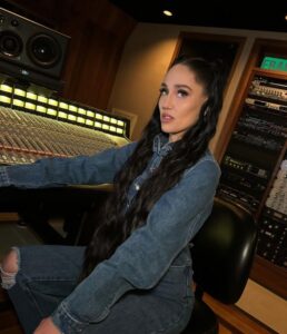 Jenna Andrews as Music Producer