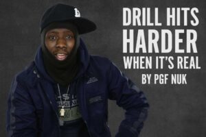 PGF Nuk wearing a navy blue jacket and layered hat, with the quote “Drill Hits Harder When It’s Real by PGF Nuk” overlaid in contrasting text